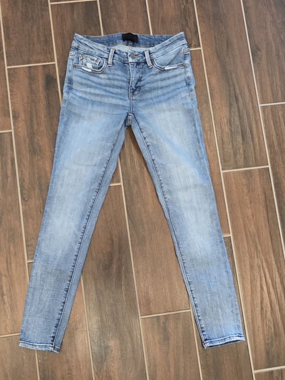 Buckle Light Blue Skinny Jeans - Women's